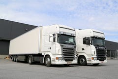 White Scania Trucks at Warehouse Building